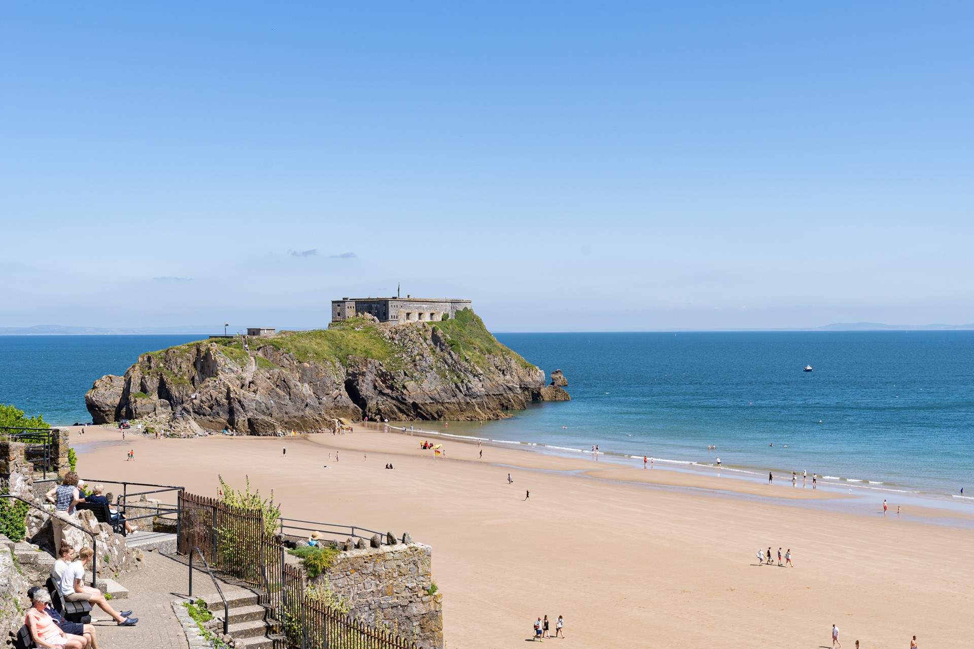 Pack a picnic and spend time on the golden sands at St Catherine's Beach in Tenby. 