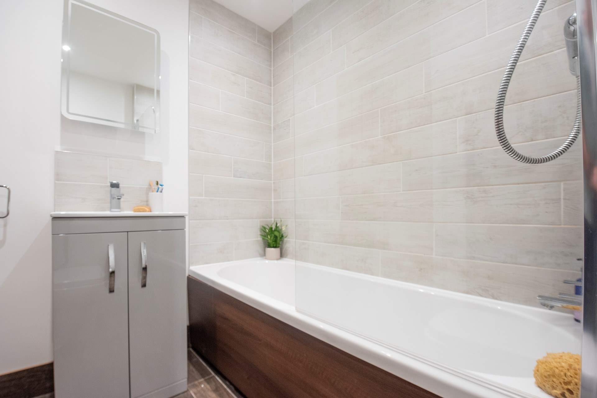 The family bathroom sits between bedroom 3 and 4 on the lower ground floor.