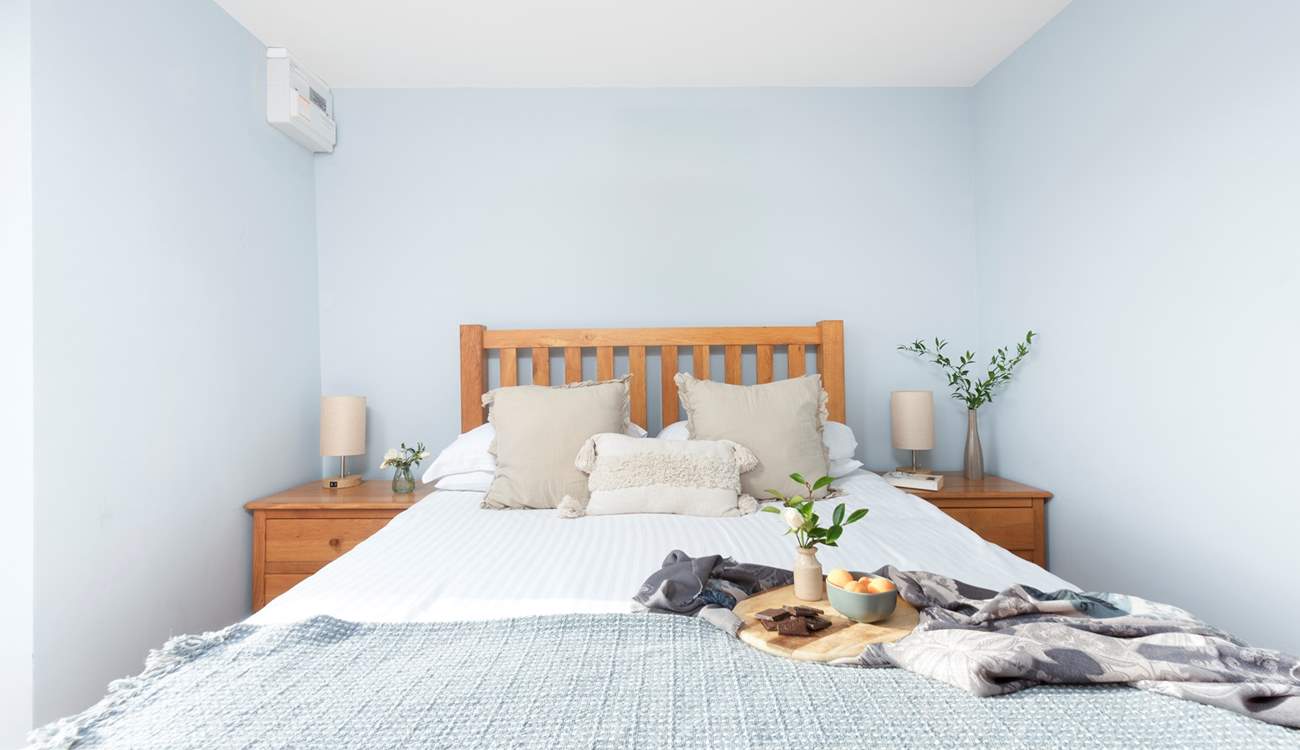 Set on the same level as the living-room, a king-size bed awaits in bedroom 1.