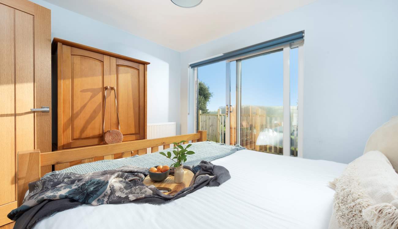 Bedroom 1 offers direct access to the decking .