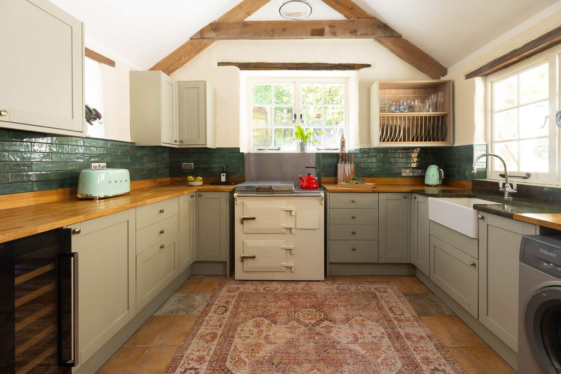 The light and airy kitchen is ever so charming. 