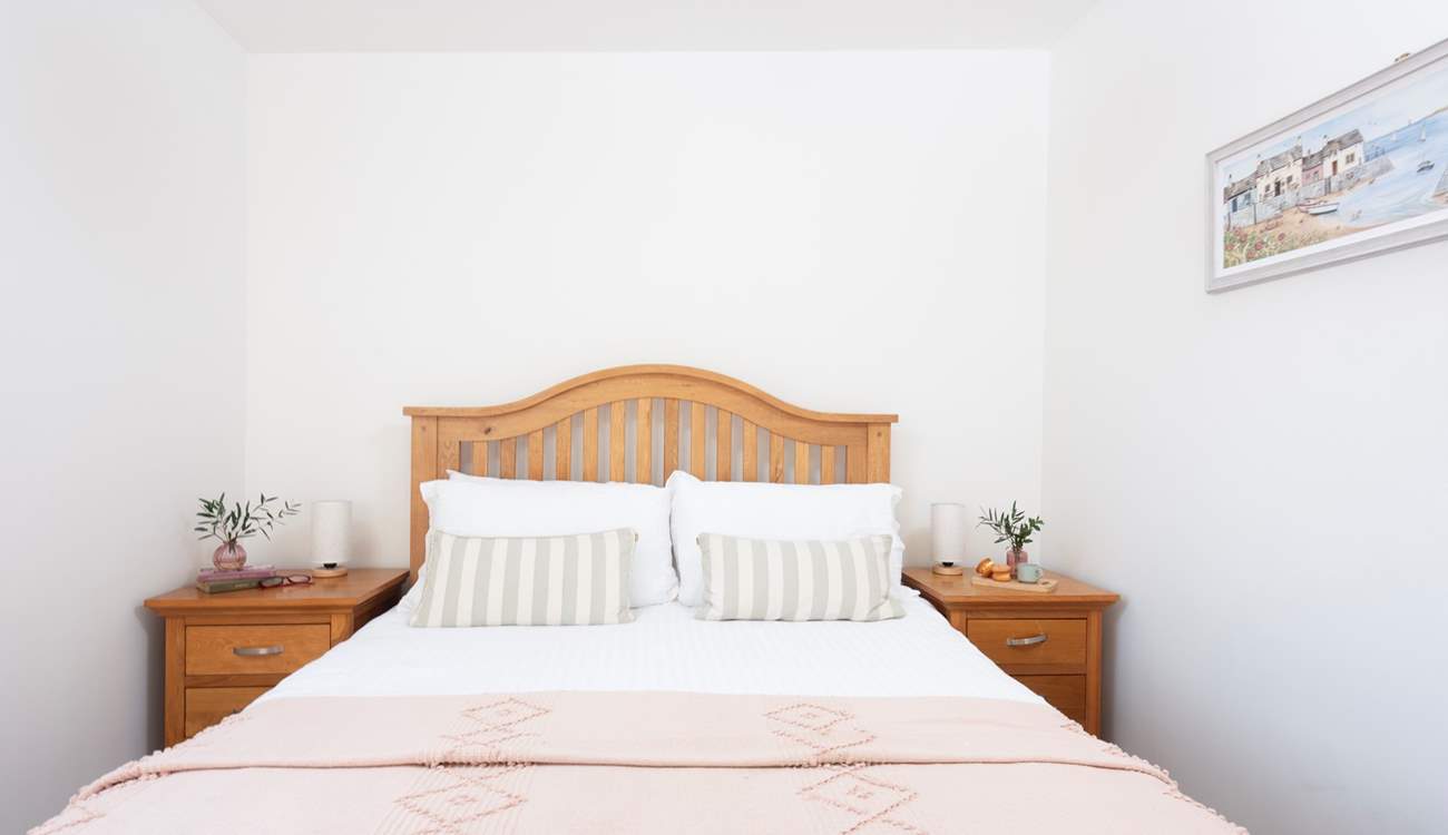 A king-size bed awaits in bedroom 1.