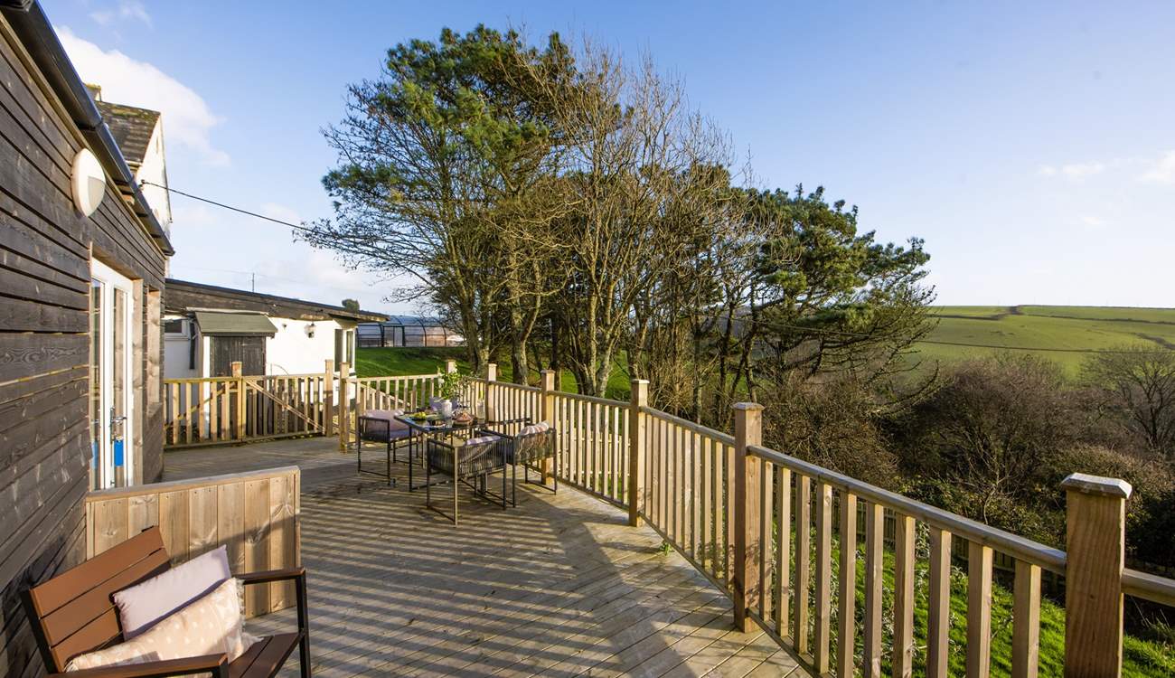 The south-facing decking runs the length of the Larch Cottage.