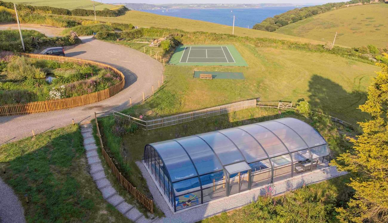 Nested in the rolling countryside yet so close to the sea...oh and if tennis is your game, there's even a tennis court so don't forget your rackets.