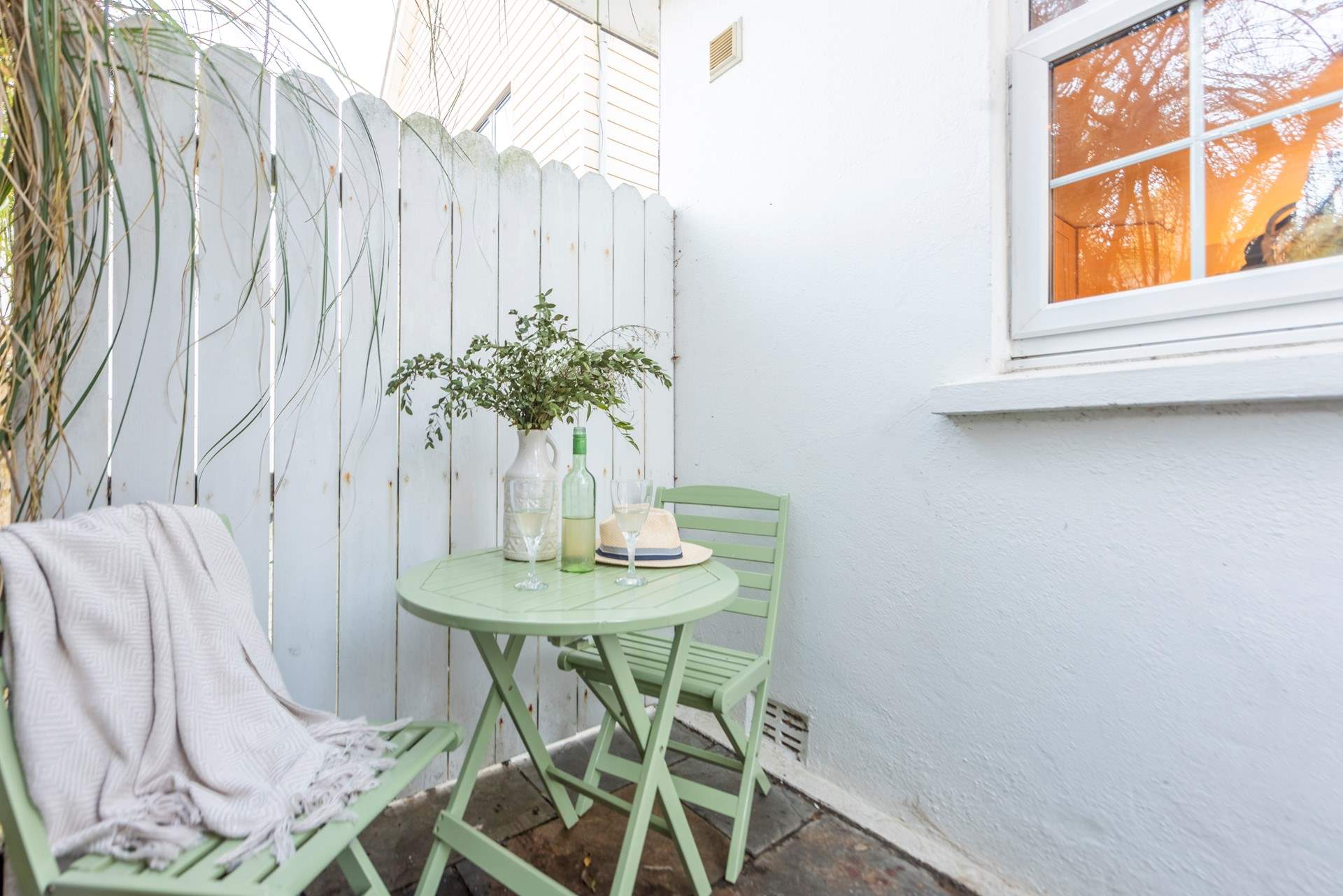 Enjoy a glass of wine in the shared courtyard and plan your day.