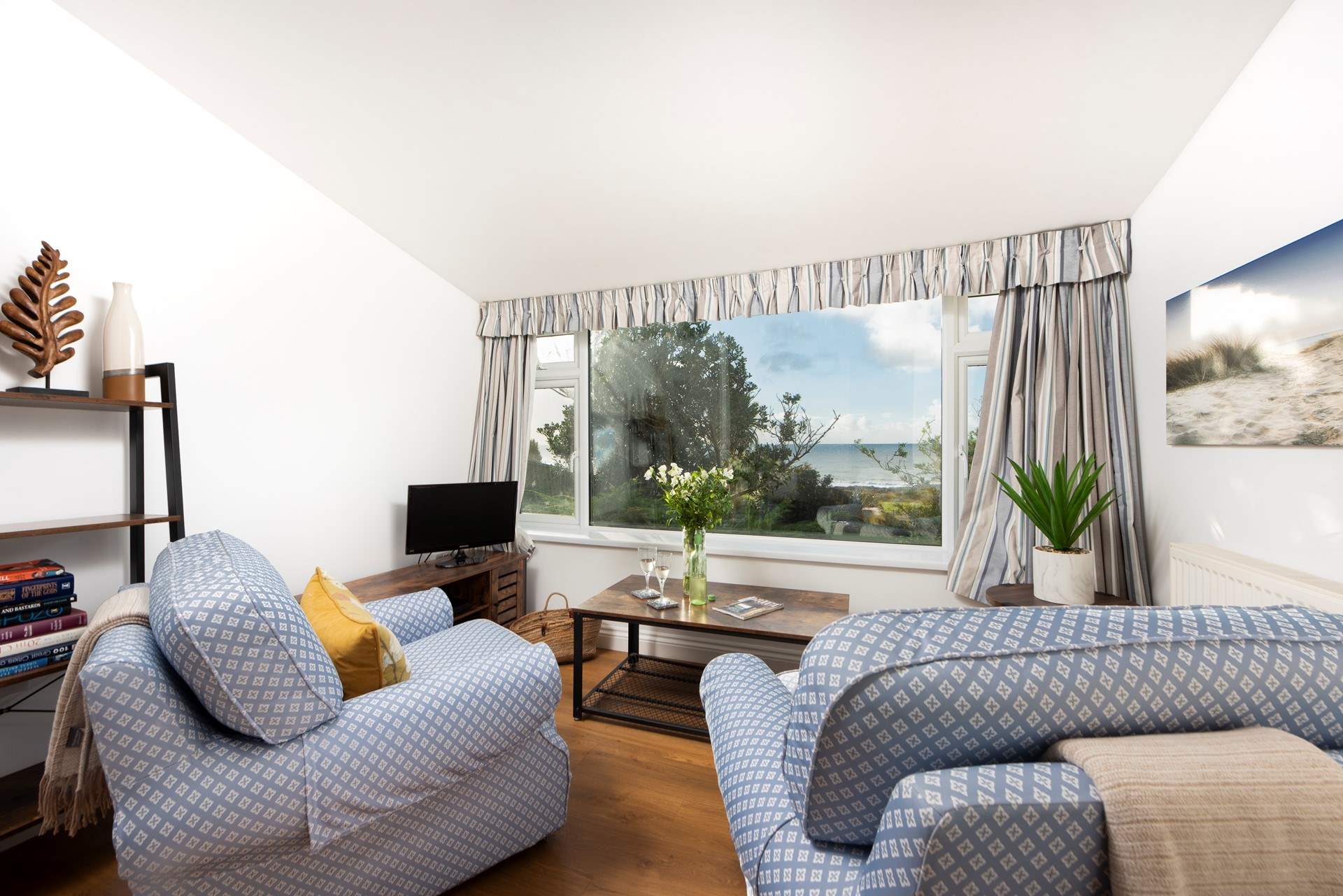 The living area is a great place to watch the Cornish weather roll in.