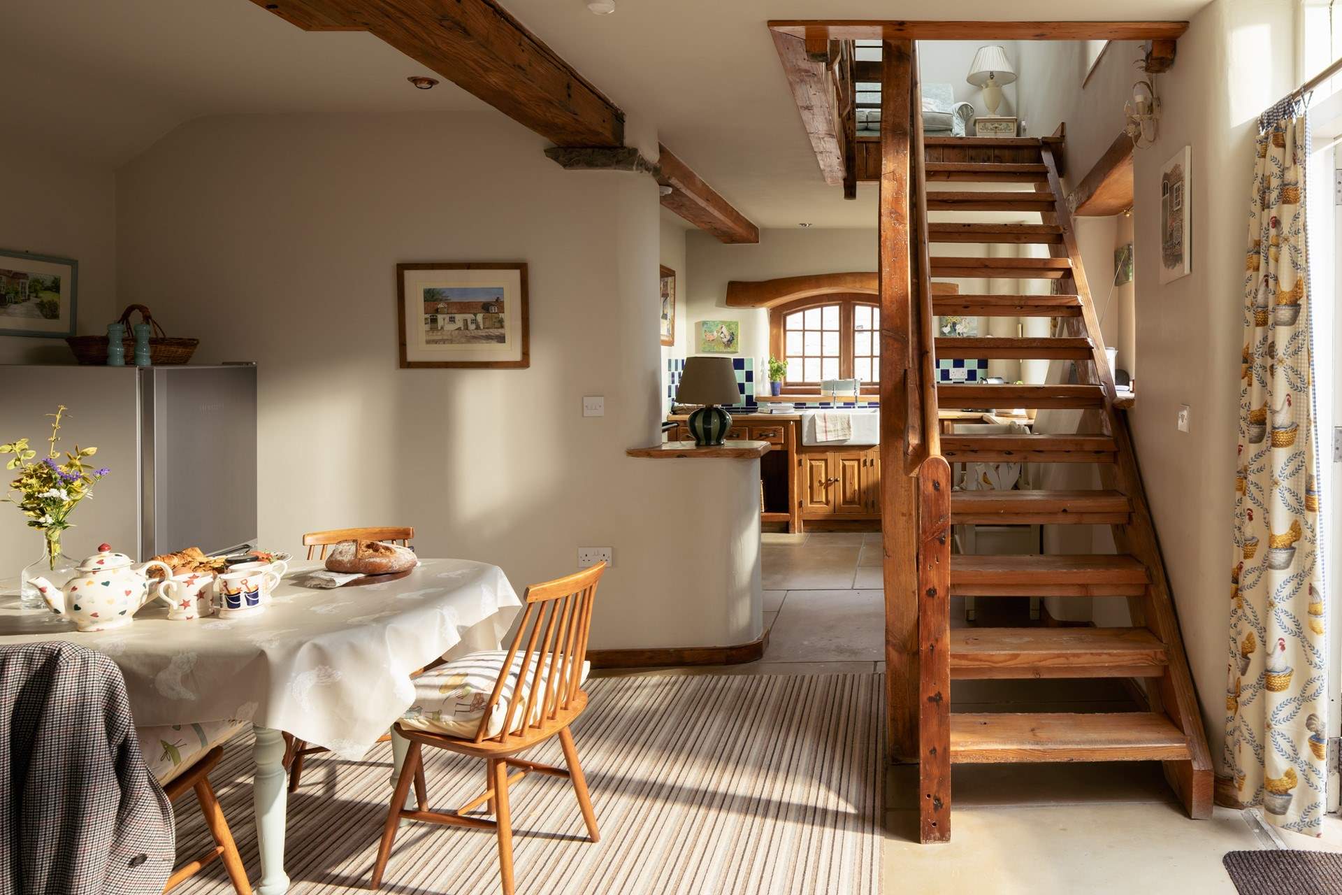 The open plan kitchen/dining-room is ideal for getting together over a meal.