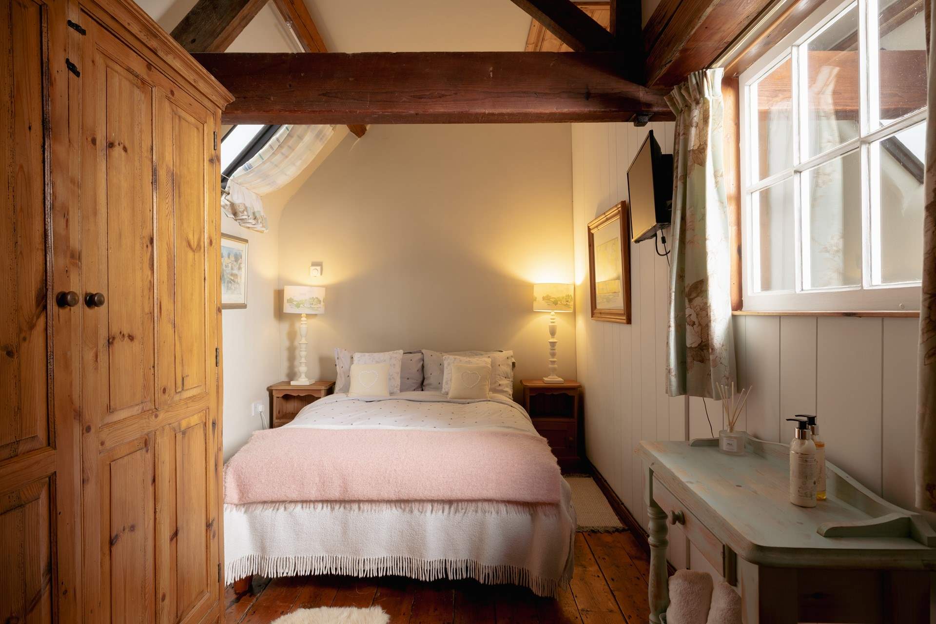 The second bedroom with more original beams.
