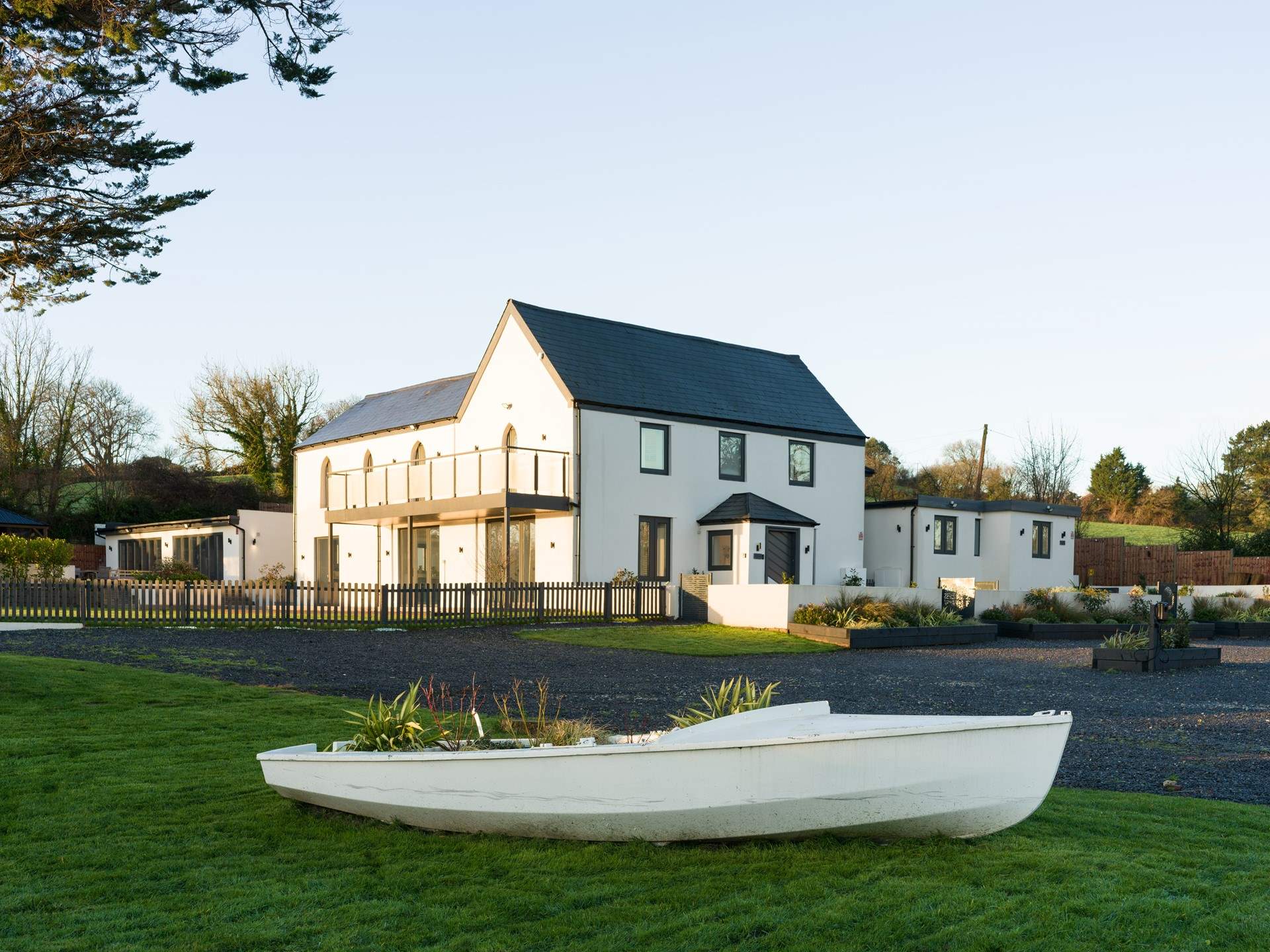 The parking area is shared between Boathyde and The Moorings with two electric vehicle charging points.