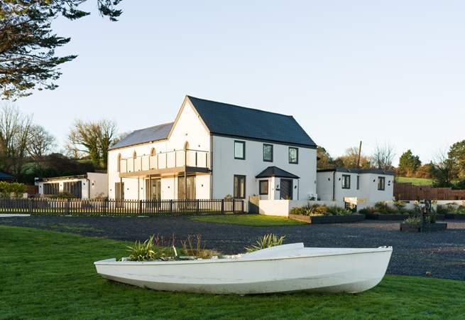 The parking area is shared between Boathyde and The Moorings with two electric vehicle charging points.