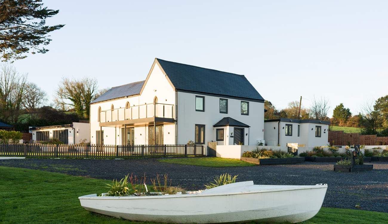 The parking area is shared between Boathyde and The Moorings with two electric vehicle charging points.