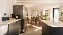 The bi-fold doors let the light flood through to this fabulous open plan room.