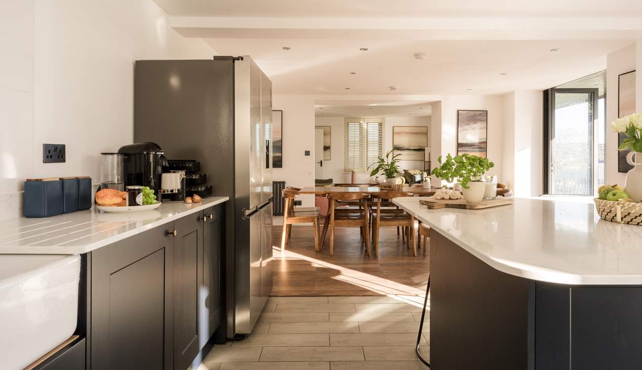 The bi-fold doors let the light flood through to this fabulous open plan room.