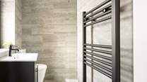 A stylish en suite shower-room with heated towel rail.
