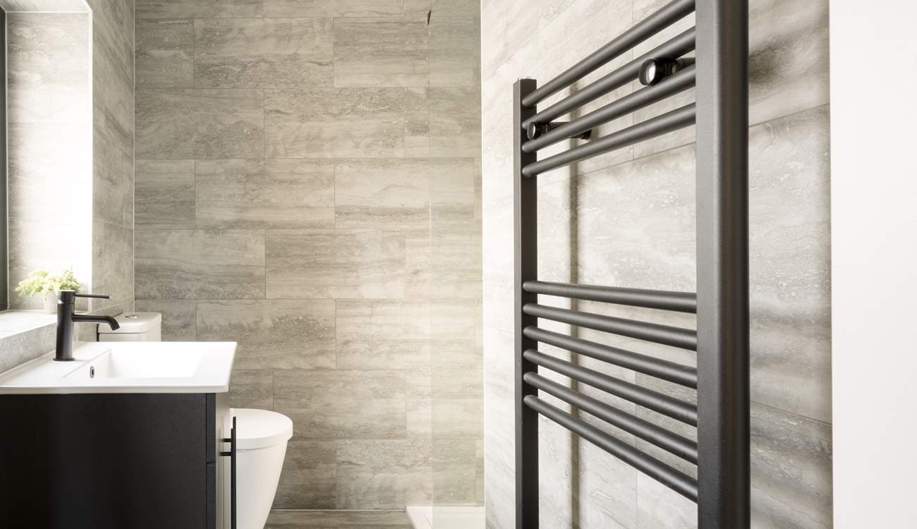 A stylish en suite shower-room with heated towel rail.