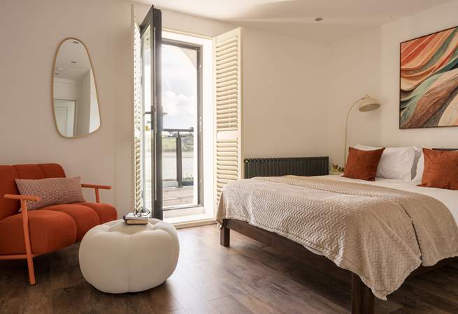 Bedroom 2 has direct access to the shared balcony.