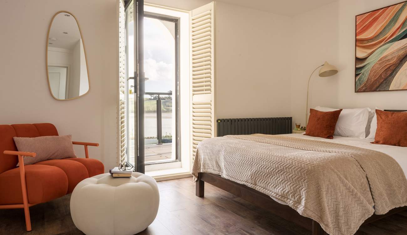 Bedroom 2 has direct access to the shared balcony.