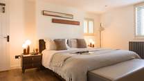 Head across to bedroom 4 that offers warming tones and relaxation.