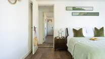 Bedroom 3 with views, access to the shared balcony and an en suite shower-room.