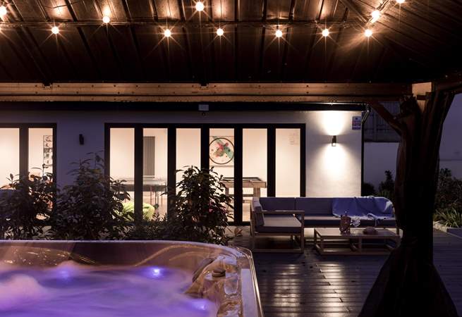 With a covered hot tub and games-room this is a destination retreat.