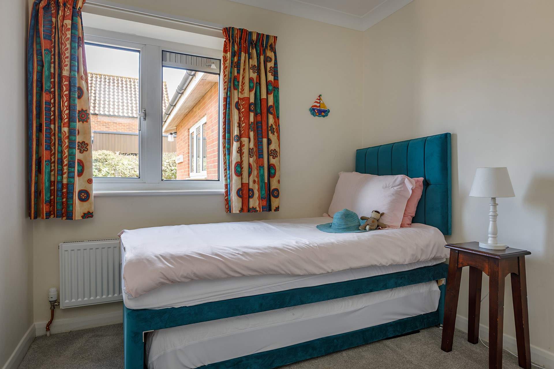 With four bedrooms to choose from, the latter has a trundle bed; ideal for youngsters.