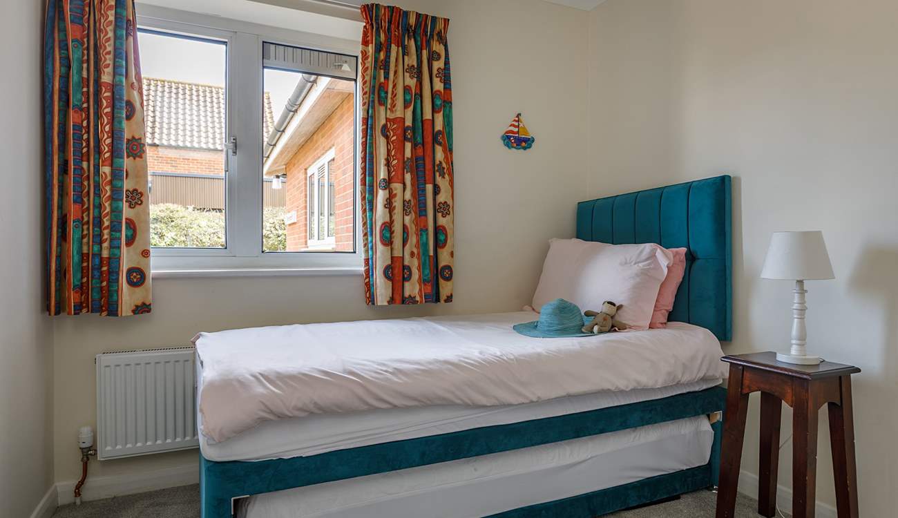 With four bedrooms to choose from, the latter has a trundle bed; ideal for youngsters.