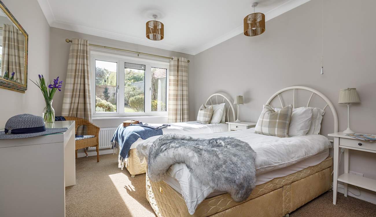 A spacious twin room with full size (three foot) beds, enjoys garden views and a spacious en suite shower-room.
