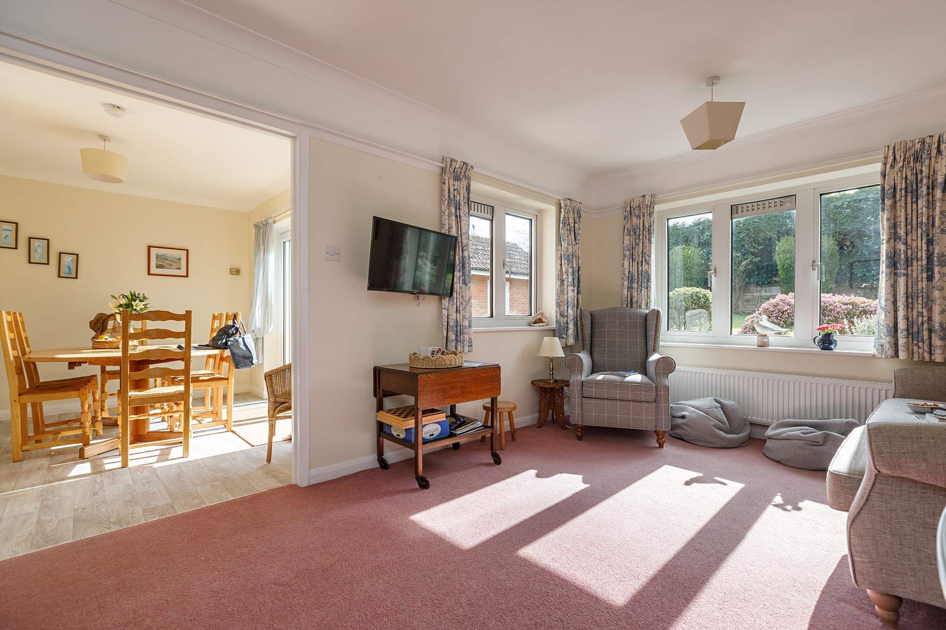 The light floods into the sitting and dining space.