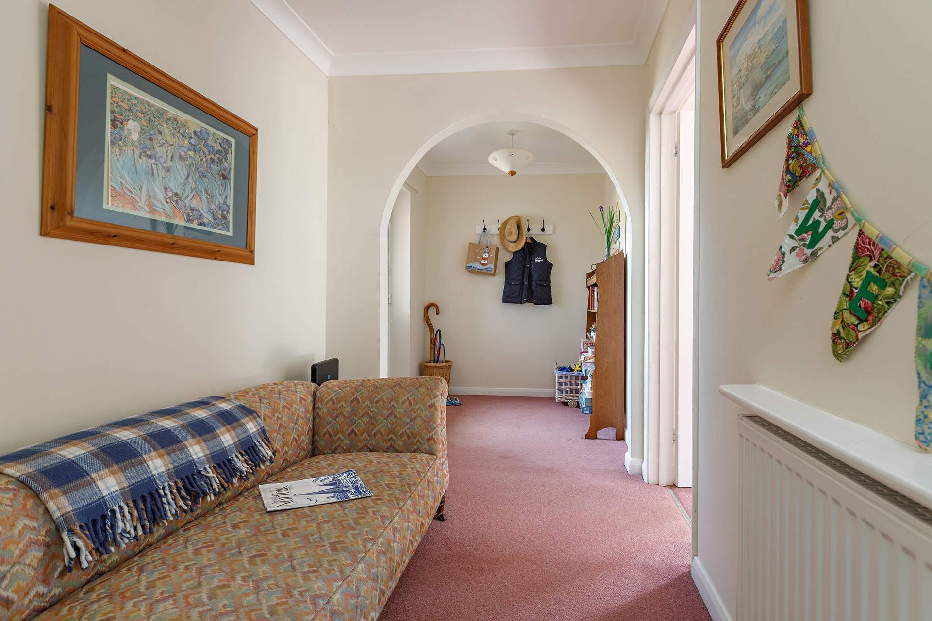 The spacious entrance hall with space to sit and kick off your shoes!