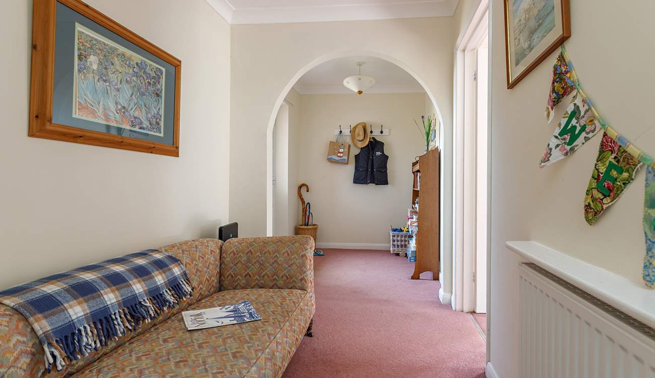 The spacious entrance hall with space to sit and kick off your shoes!