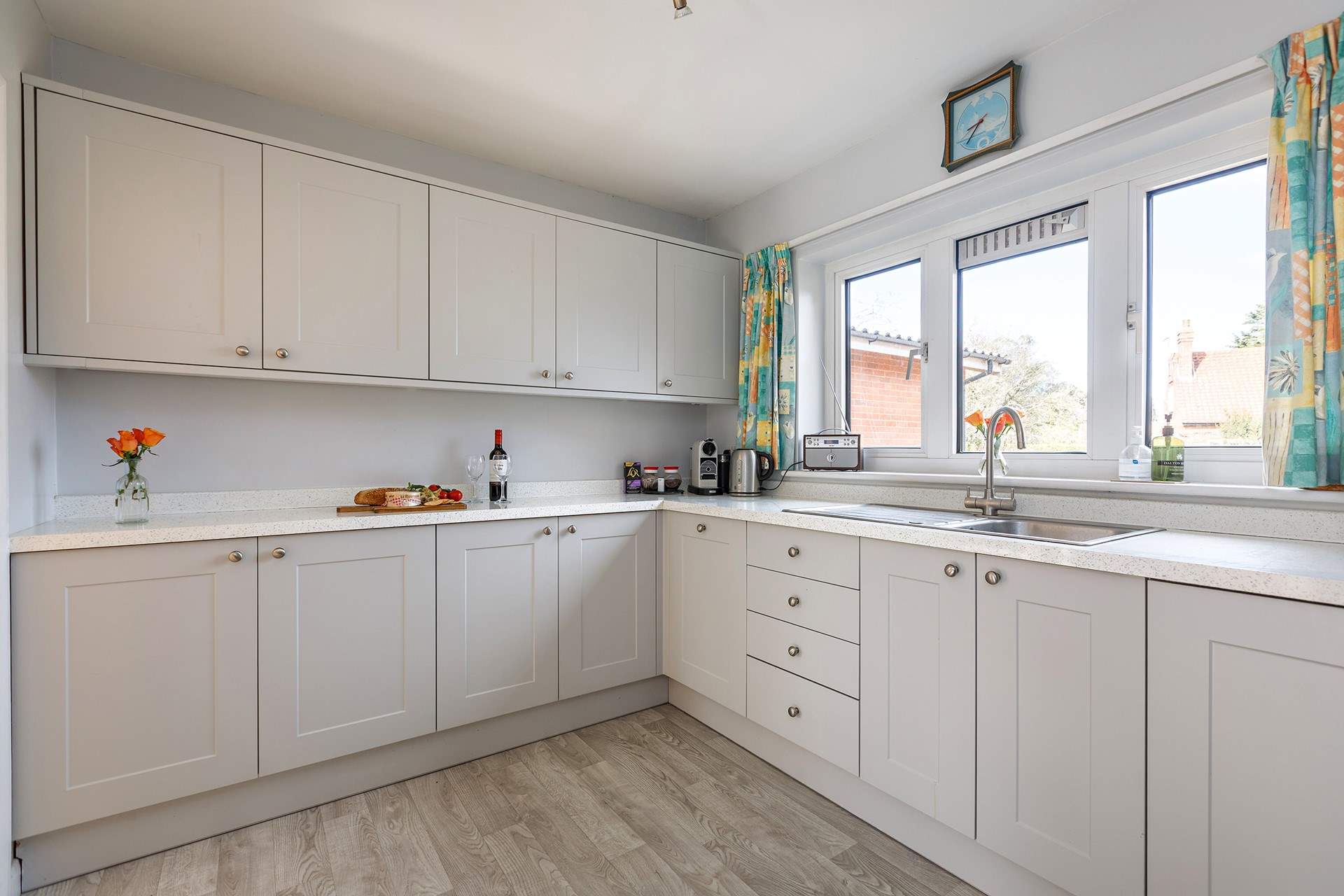 The spacious kitchen is accessed from the dining-room with plenty of amenities and a handy utility-room next door.