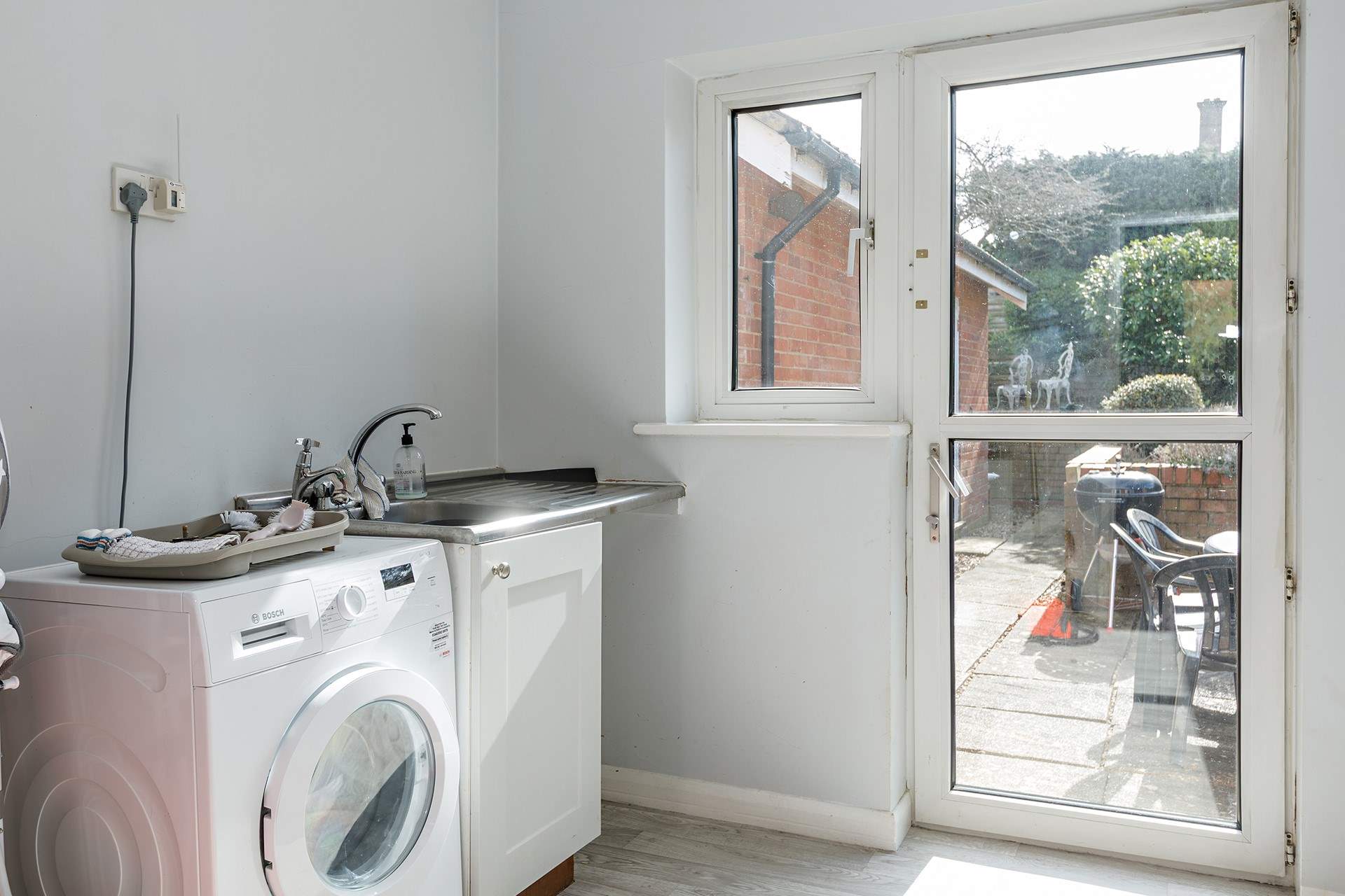 The large utility-room is ideal for sandy shoes and coats on cooler days complete with washing machine.