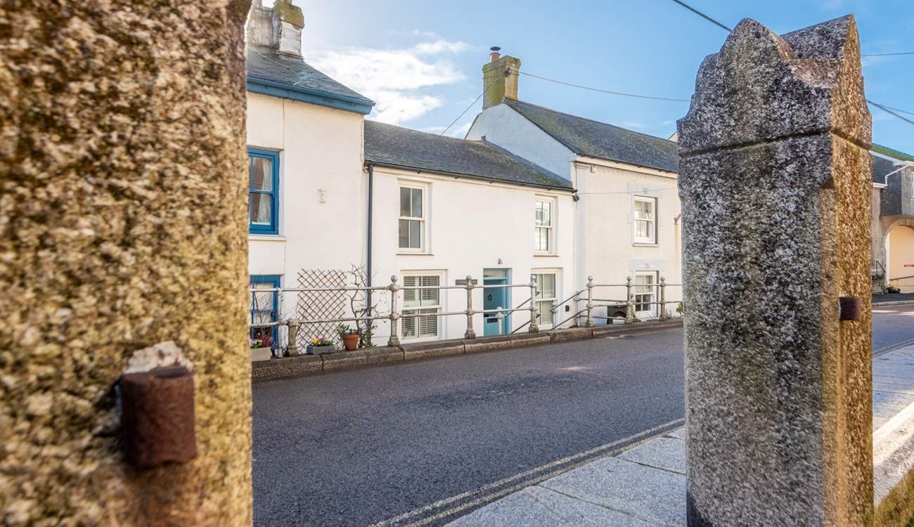 The cottage is set slightly back from the road down three ancient granite steps opposite the Methodist Church. Private parking for one car is at the side of the neighbouring property.