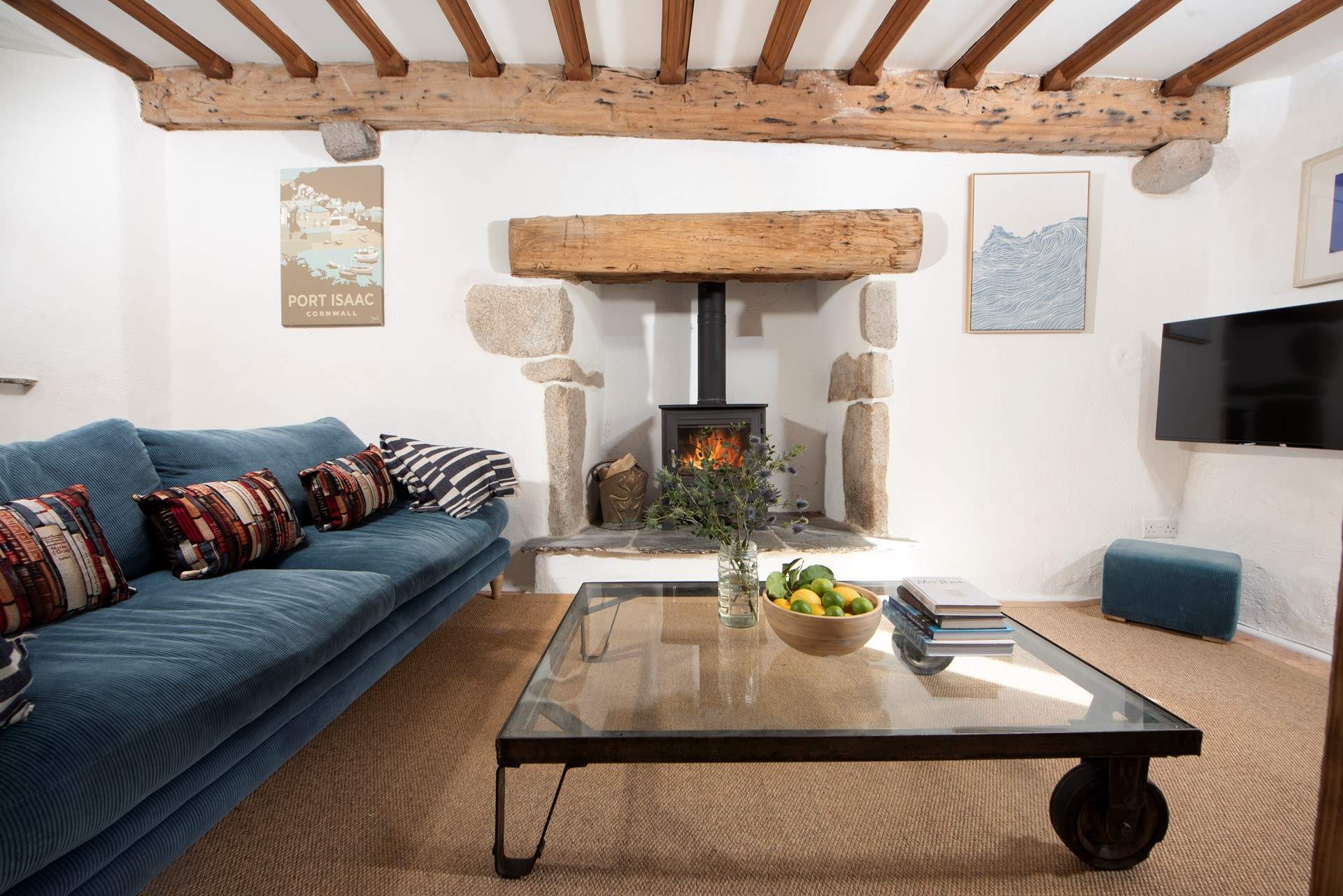 Sink into the sofa and warm yourself by the wood-burner.