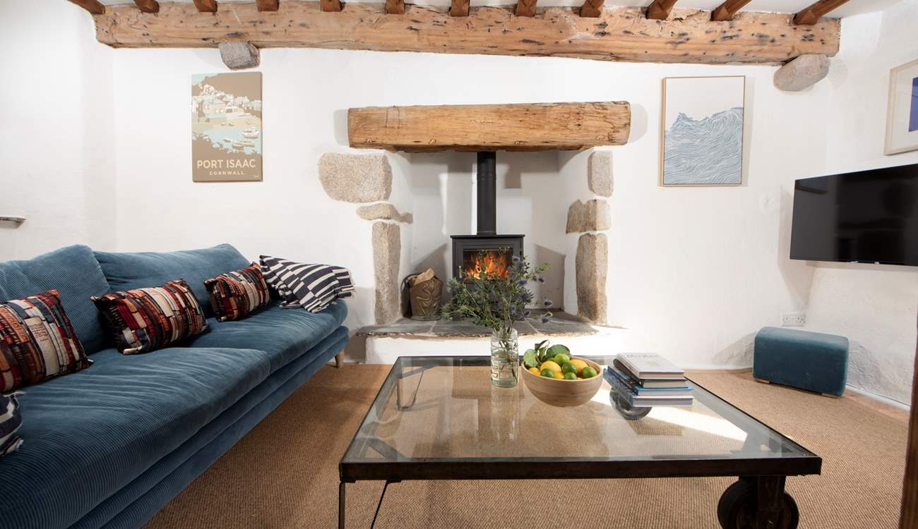 Sink into the sofa and warm yourself by the wood-burner.