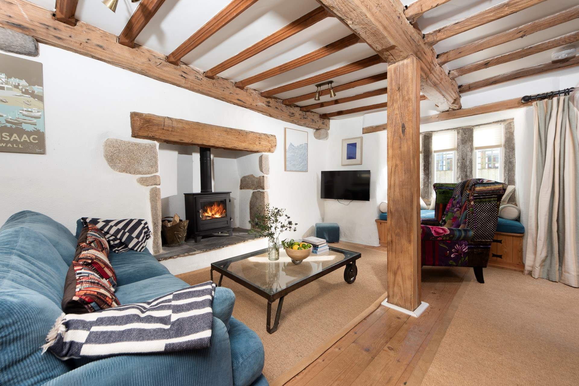 The beamed ceiling adds character to the open plan space.