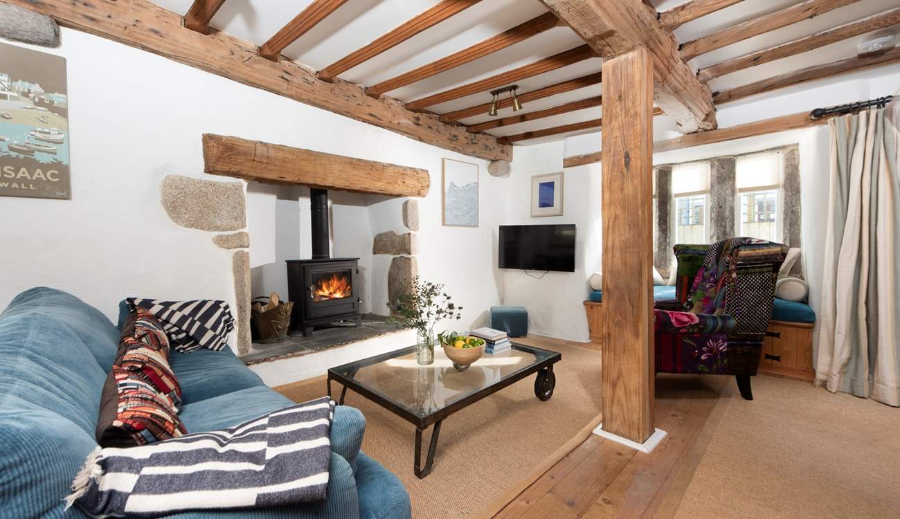 The beamed ceiling adds character to the open plan space.