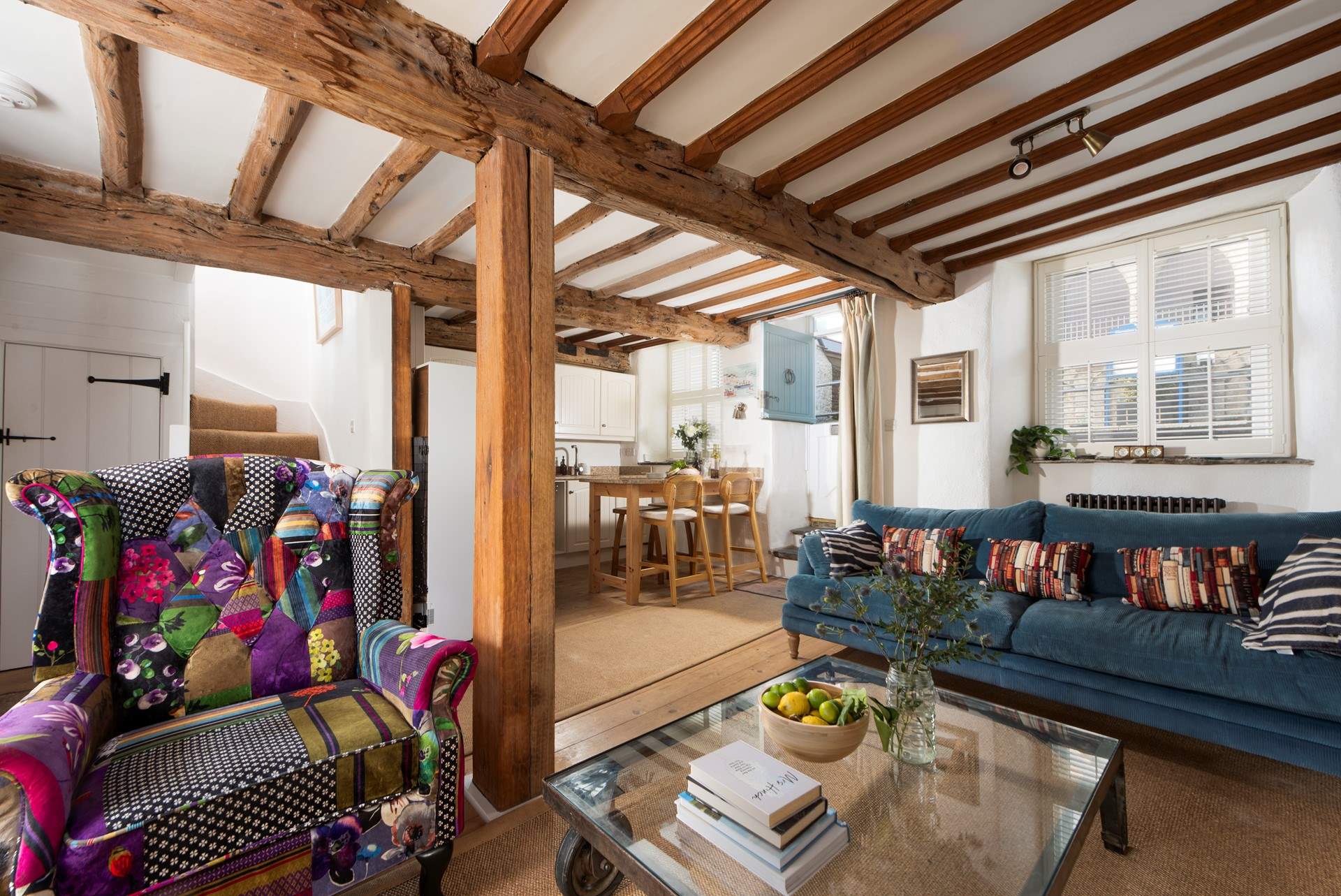 The open plan area includes the kitchen and breakfast-bar.