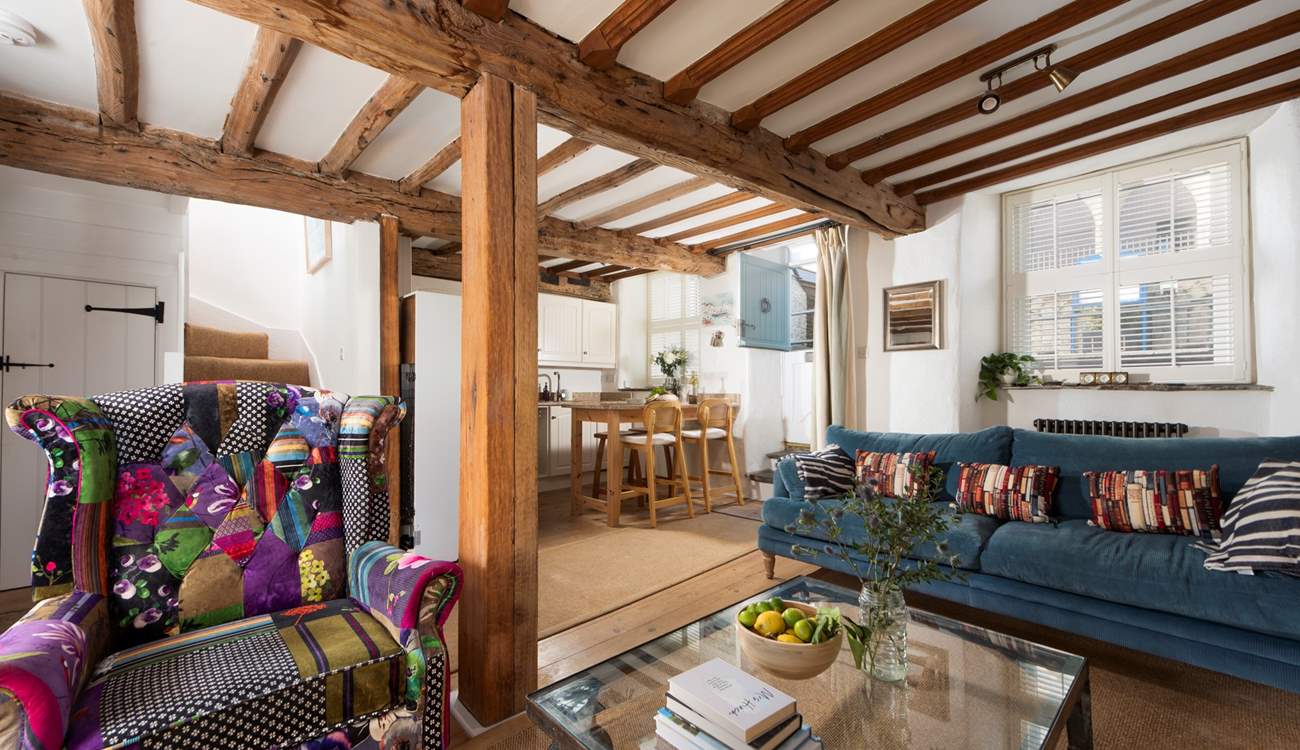 The open plan area includes the kitchen and breakfast-bar.