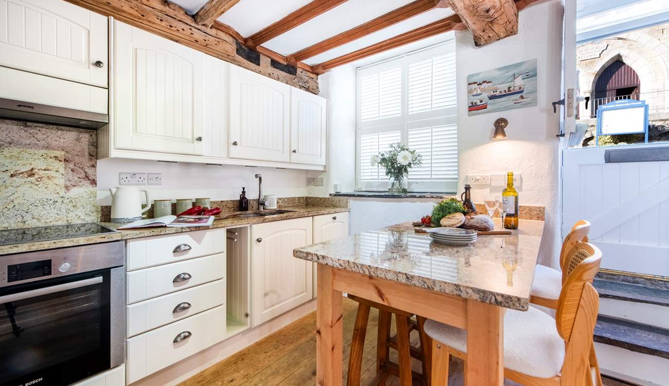 A well appointed kitchen and a very social space.