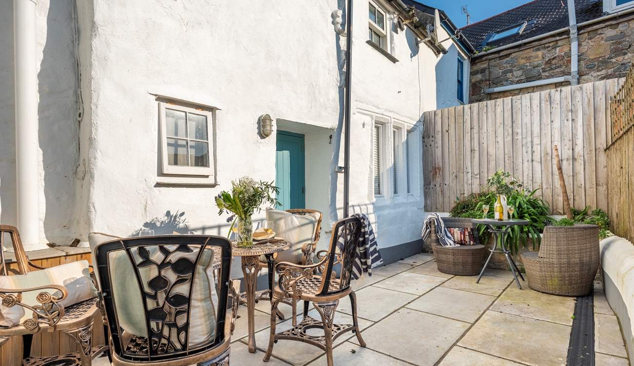 A sweet courtyard at the rear of the cottage is perfect for outdoor dining, you can hear the sea just behind you.