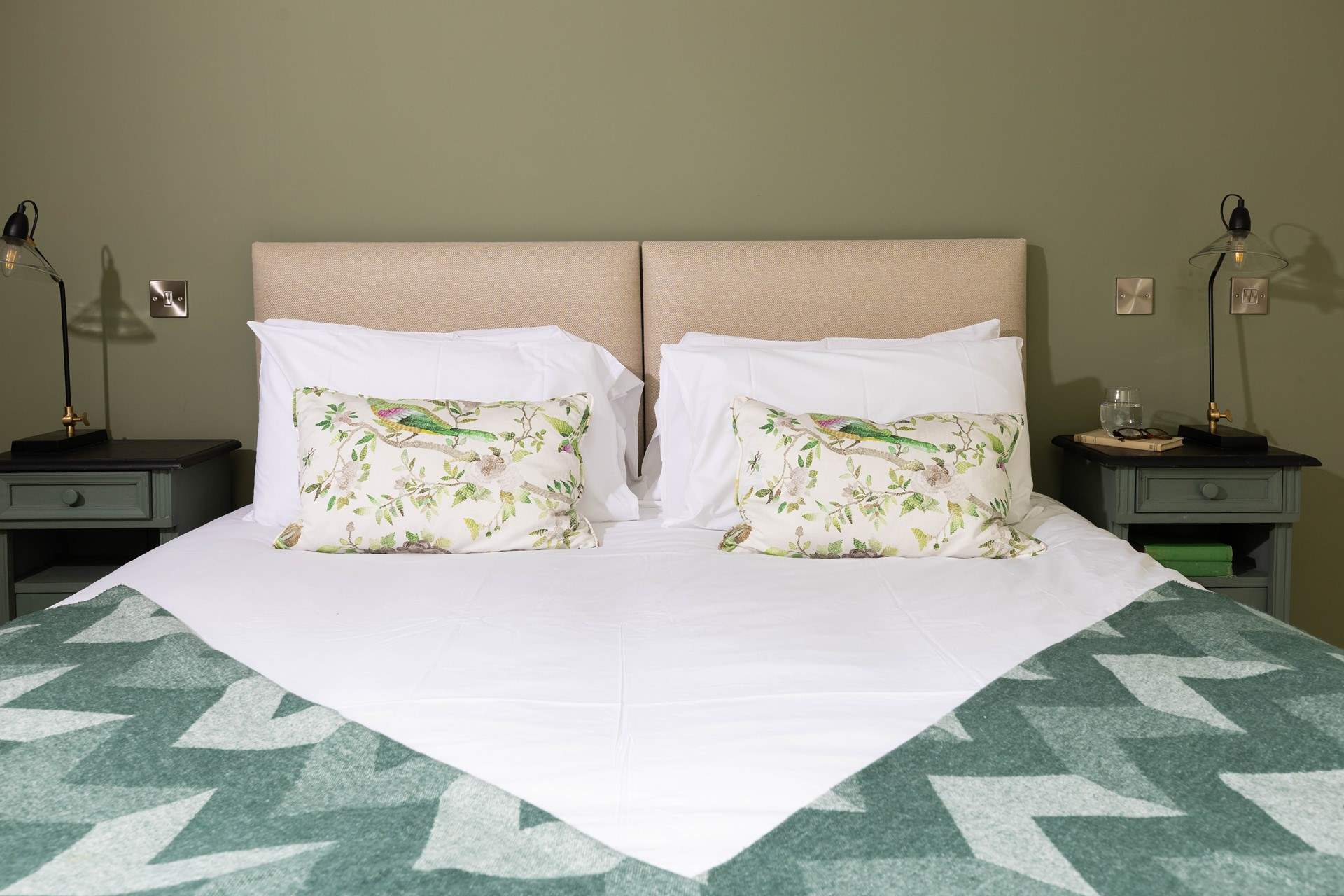 Tranquil greens for a good night's sleep in Bedroom 1. 