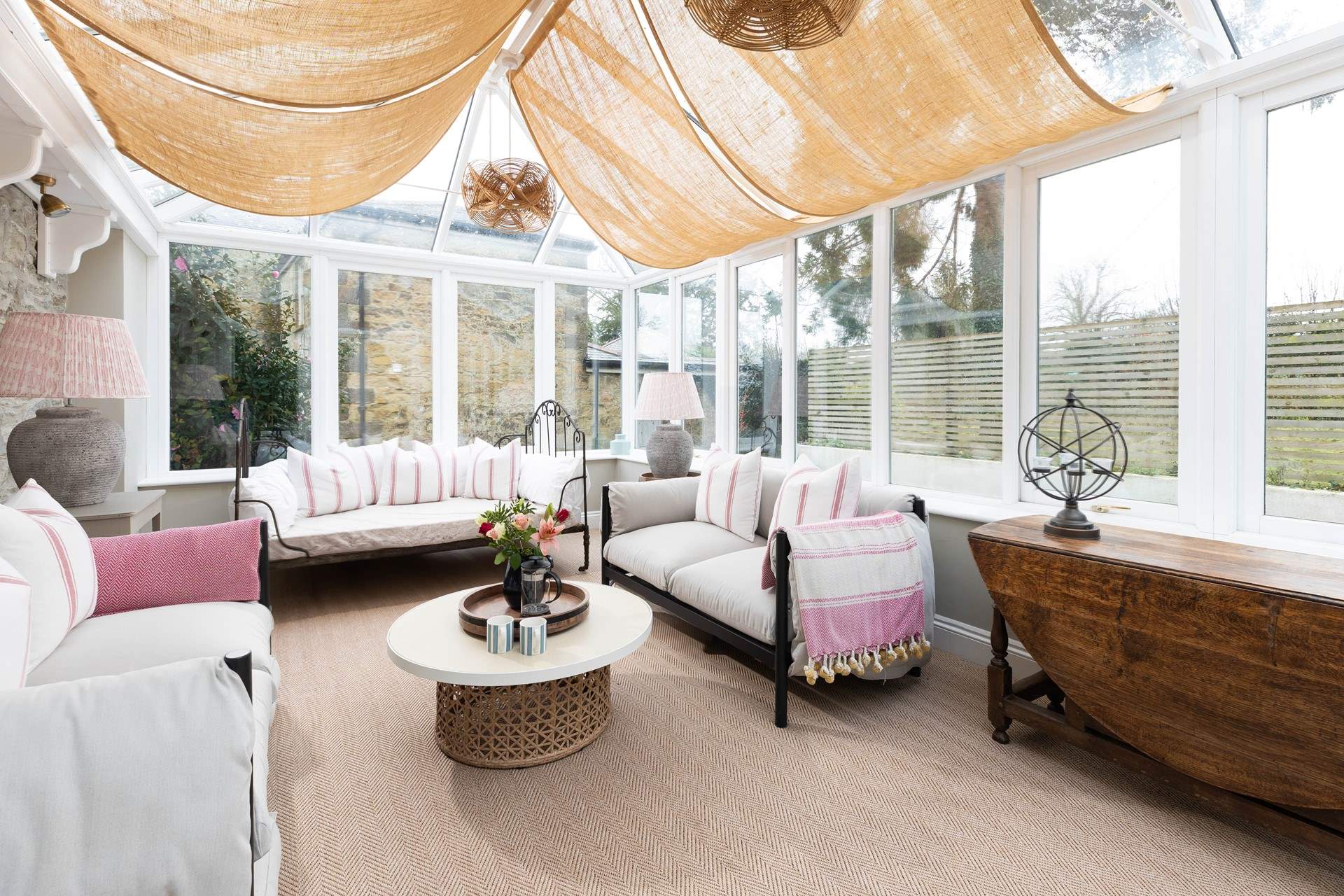 The sunny conservatory is the perfect spot for a pre supper G&T. 