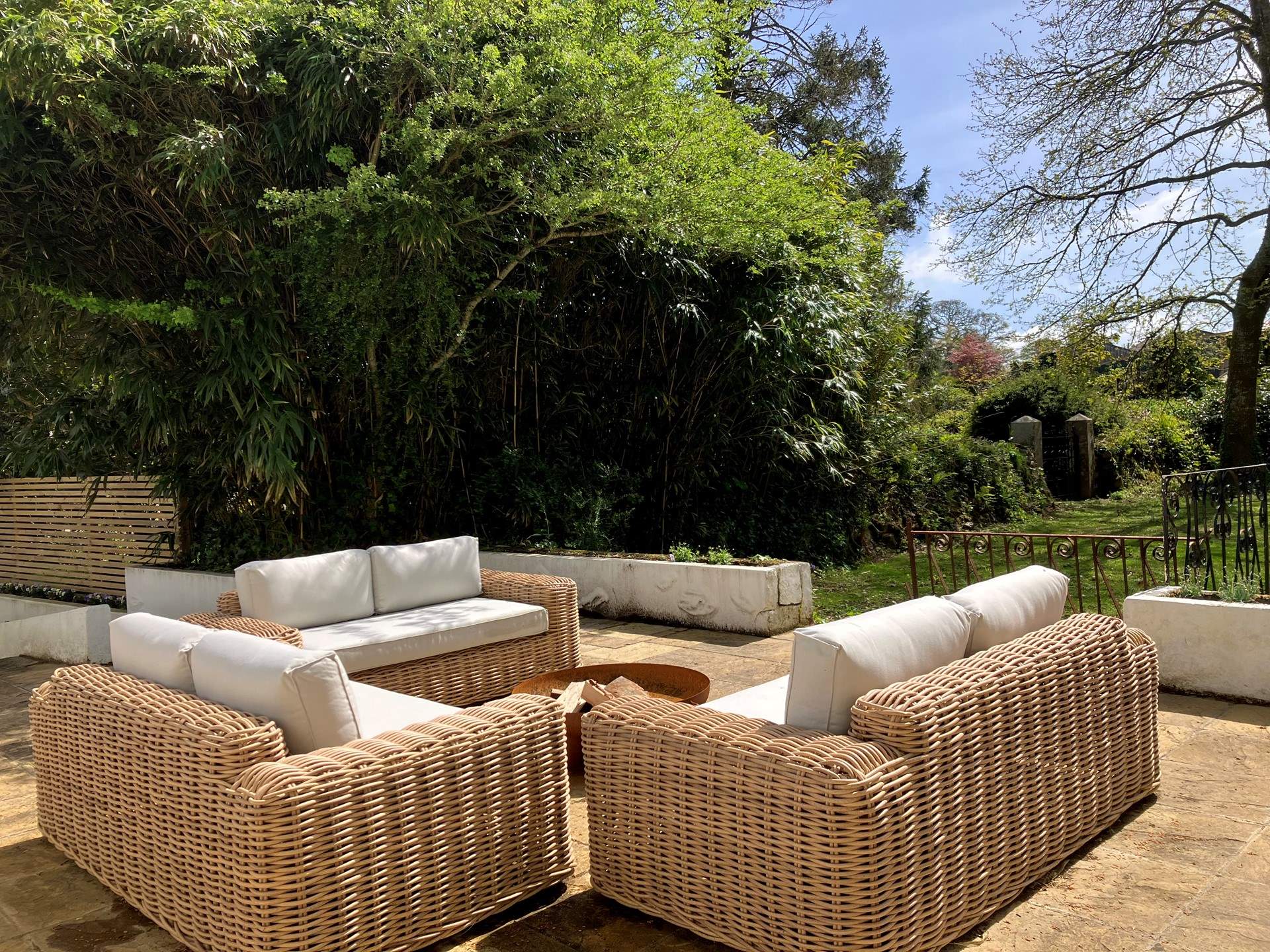 The sofas overlook the sunny sheltered garden. 