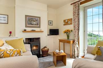 Relax on the sofa and enjoy the fabulous view (the wood burner is decorative only).