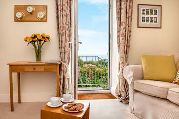 The sitting-room opens onto the garden.