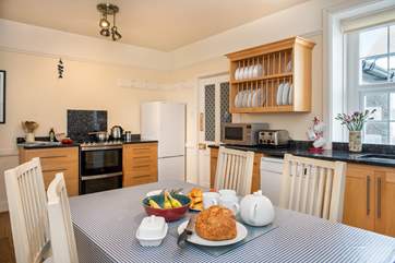 The eat-in kitchen is the perfect spot for a group meal.