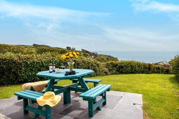 Enjoy the garden and watch the boats pass by.