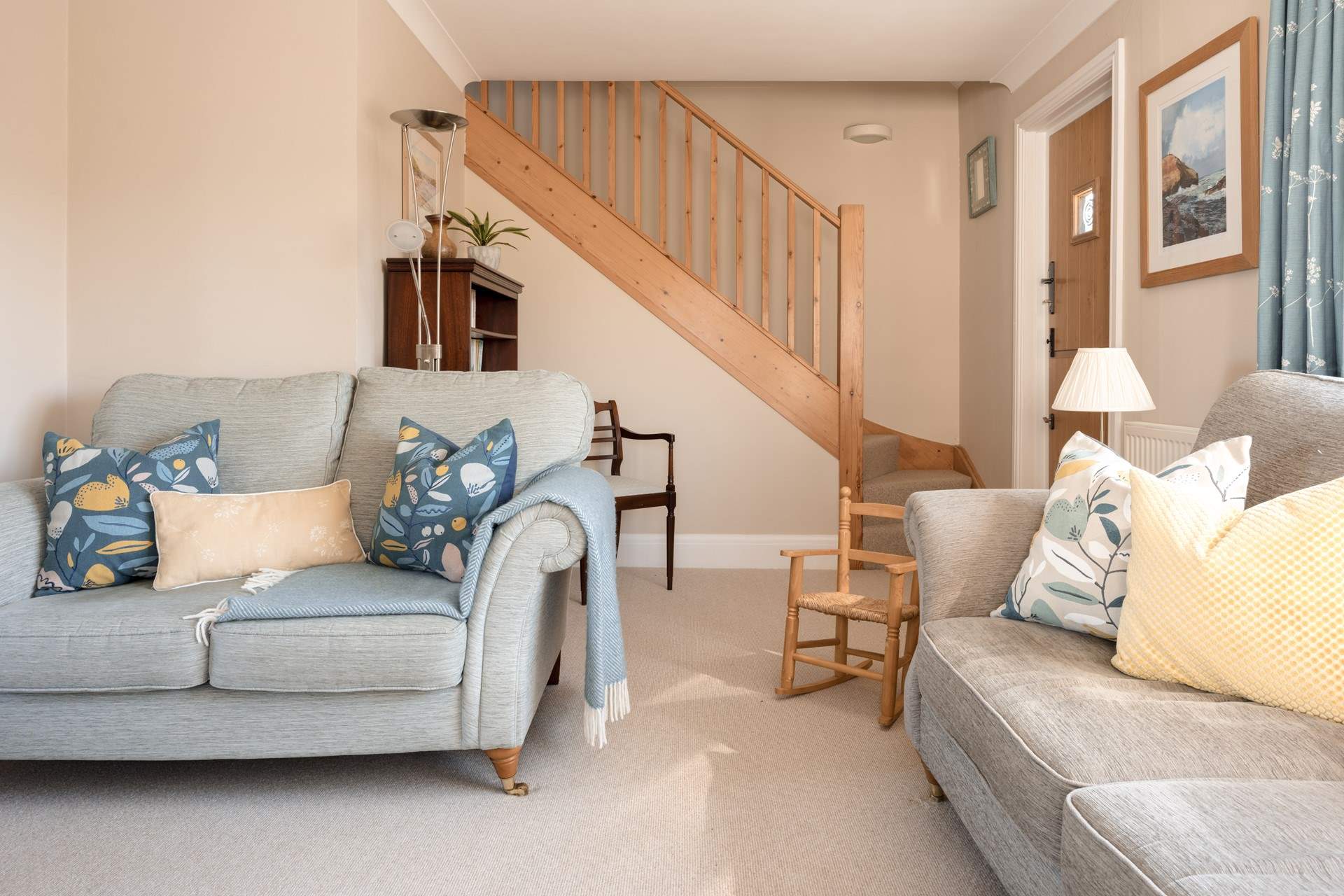 From the sitting-room climb the stairs to find the principal bedroom.