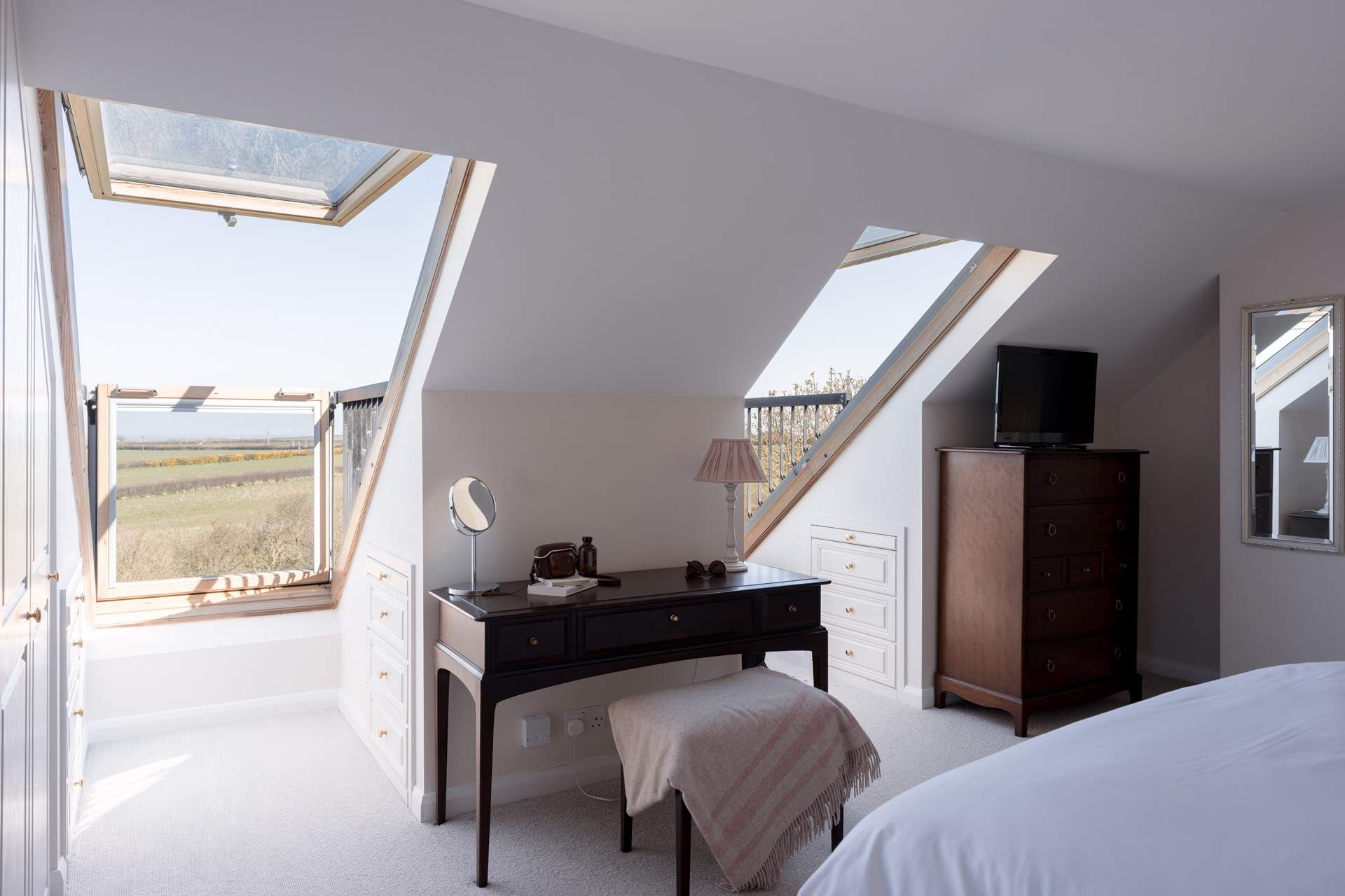 These Velux windows open to give a balcony feel with views towards the coast.
